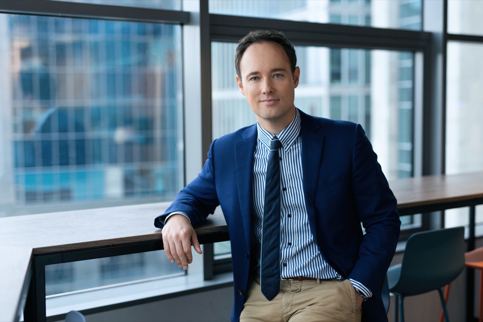 Martynas Kairys, professional portrait in a navy blazer
